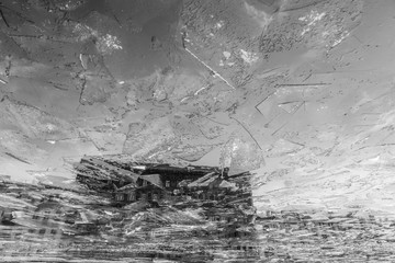 Vintage apartment house reflected in freezing Fontanka river