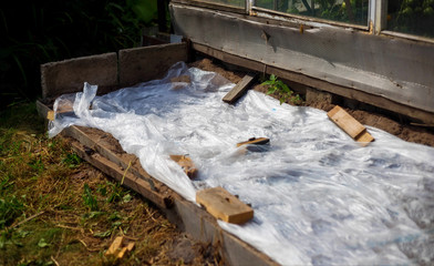 Greenhouses made of polymer film. Early spring