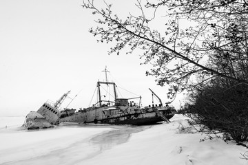 Fototapeta premium Frozen ship graveyard with two rusty industrial ships