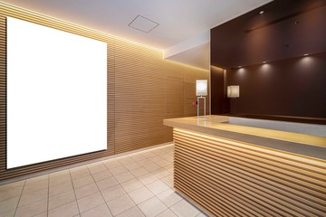 Blank advertising signs placed behind the reception counter at the office building.