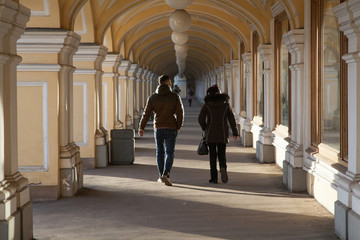 People walk through the gallery of old shopping malls