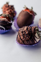 Strawberry with chocolate on a with background