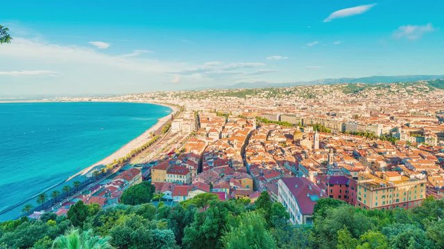 4K timelapse of Nice city,Cote d'Azur,France.Aerial view of Nice city and luxury resort of French riviera, sunrise in a sunny summer day.Famous tourist destination with nice beach on Mediterranean sea