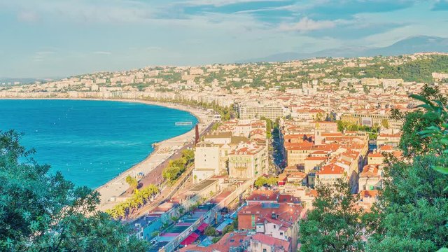 4K timelapse of Nice city,Cote d'Azur,France.Aerial view of Nice city and luxury resort of French riviera, sunrise in a sunny summer day.Famous tourist destination with nice beach on Mediterranean sea