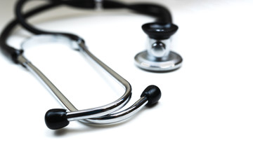 Black Stethoscope and phonendoscope isolated on white close up. Selective focus. Medical concept. 