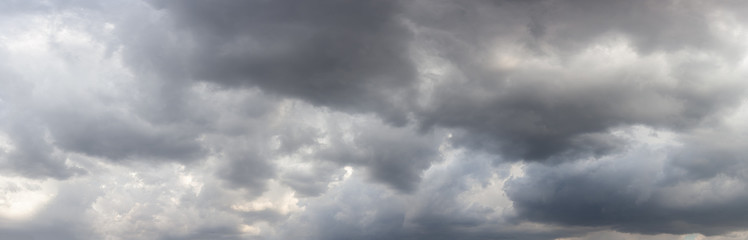 Panorama of a dark sky with storm clouds, as background.