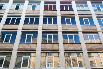 Shabby windows of old apartment buildings in St. Petersburg