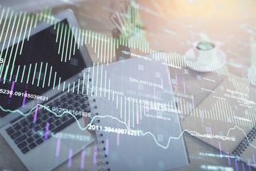 Double exposure of businesswoman hands typing on computer and forex chart hologram drawing. Financial analysis concept.
