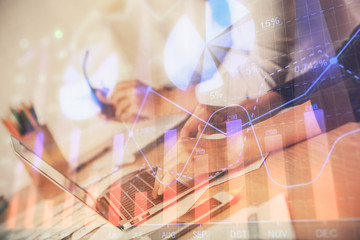 Multi exposure of woman hands typing on computer and financial chart hologram drawing. Stock market analysis concept.