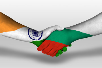 Handshake between bulgaria and india flags painted on hands, illustration with clipping path.