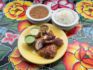 Peruvian roast chicken with rice and beans. 