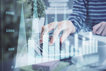 Double exposure of woman hands typing on computer and forex chart hologram drawing. Stock market invest concept.