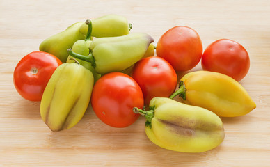 Red fresh tomatoes and green sweet pepper.