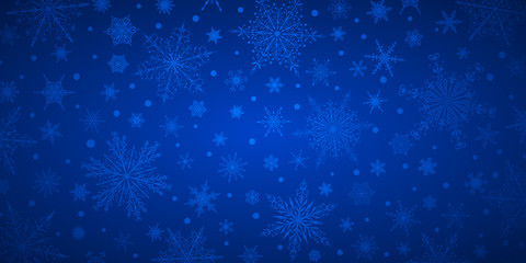Fototapeta na wymiar Christmas background of various complex big and small snowflakes, in blue colors