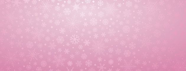 Christmas background of various complex big and small snowflakes, in pink colors