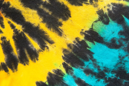 yellow and blue tie dye stripe pattern.