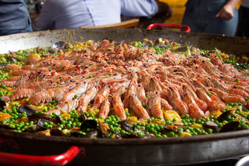 Traditional spanish paella with seafood and pork. Prepared