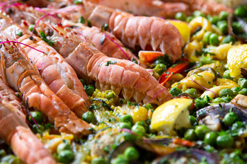 Traditional spanish paella with seafood and pork. Prepared