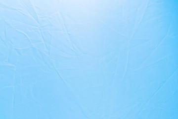 texture of a wrinkled light blue fabric