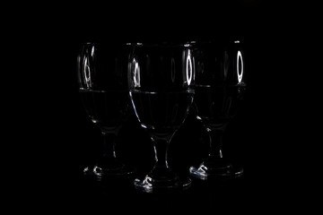 champagne glasses on black background