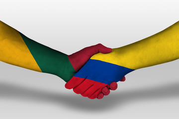 Handshake between columbia and lithuania flags painted on hands, illustration with clipping path.