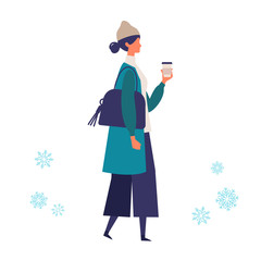 A young woman walking in winter. Stylish woman walking around the street.