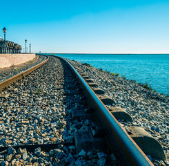 Fototapeta na wymiar Railroad of Faro next to the sea