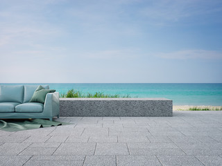Sofa on outdoor terrace near garden in modern beach house or luxury villa. Cozy home patio 3d rendering with sea view.
