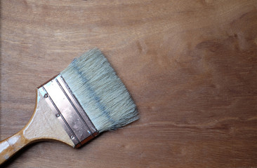 paint brush on horizontal wooden background 
