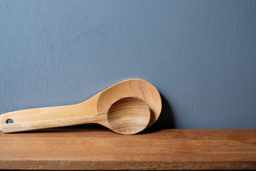 wooden kitchen utensils on gray background.