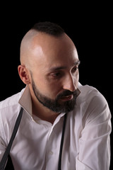 Reflective young caucasian male looking to the side