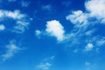 Blank sky surface with small clouds