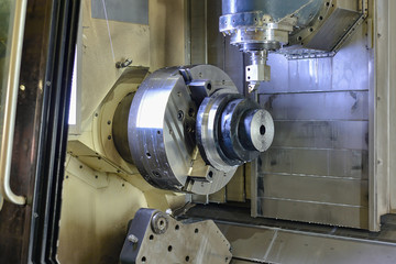 CNC machining center. The rough part after heat treatment is installed in a chuck for further cutting on a cnc machine.
