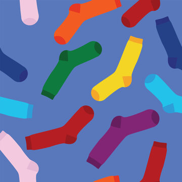 Multi-colored socks on a blue background seamless pattern. View from above.