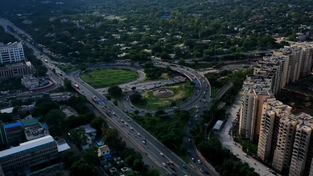 A Hyperlapse aerial shot of the flyover with running traffic in New Delhi, India