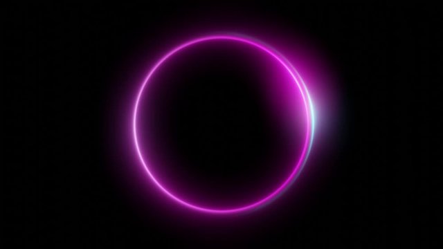 Glowing neon color circle motion background animation on black background. 