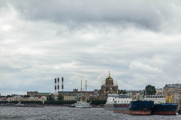 Plakat Vasilievskiy island cloudy cityscape. Neva river embankment
