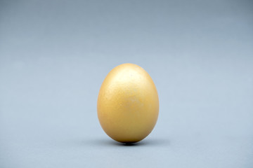 One golden egg that stands out, showing leadership, and business success strategies