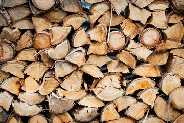 Winter cut wood pile drying outside 