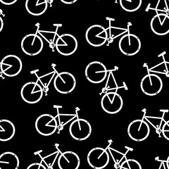 Obraz premium Mountain bikes seamless vector background. Bicycle pattern repeat white on black. Distressed grunge style. Monochrome hipster sport design for fabric, wrapping, sports wear, jersey, flyers.