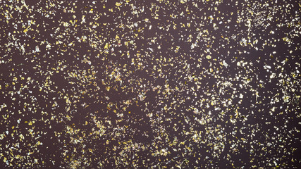 Bright golden sparkles or glitter confetti background.