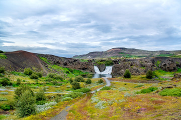 Double waterfall Hjalparfoss on the river Fossa in Highlands of Iceland. Selective focus