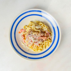 Plate of penne pasta with cheese and meat. Healthy and delicious dinner.