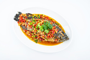 Braised grouper in a dish of Chinese cuisine on white background