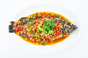 Braised grouper in a dish of Chinese cuisine on white background