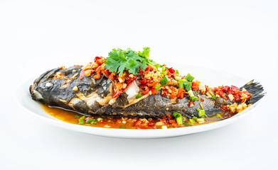 Braised grouper in a dish of Chinese cuisine on white background