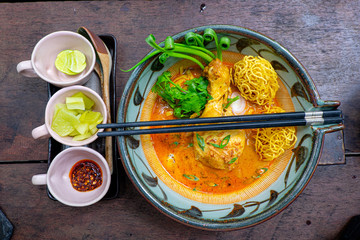 Curried Noodle Soup (Khao soi) with coconut milk, Northern Thai cuisine.