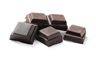 Pieces of delicious dark chocolate isolated on white