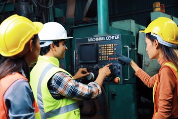 Engineering group working at factory.