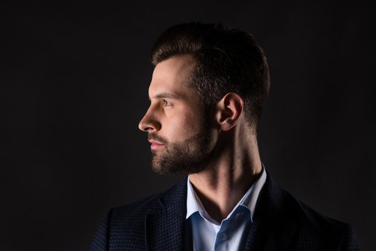 Close-up profile side view portrait of his he nice attractive luxury elegant employer guy finance expert banker agent broker director wearing formalwear isolated over dark black color background